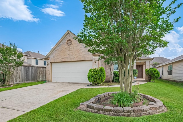 obstructed view of property with fence, a garage, driveway, and a front lawn