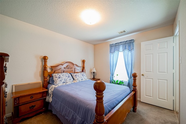 bedroom with carpet flooring and visible vents