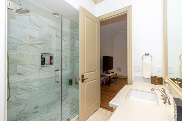 bathroom with vanity, a stall shower, and visible vents