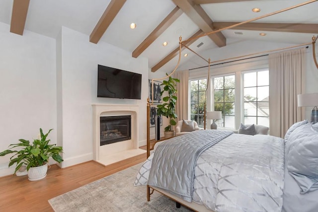 5262 Huckleberry Ln, Houston, TX 77056 - bedroom with recessed lighting, a glass covered fireplace, wood finished floors, and baseboards