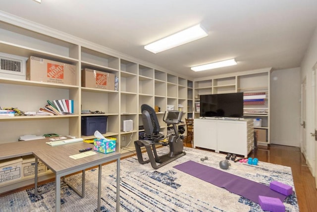 office space featuring wood finished floors and visible vents