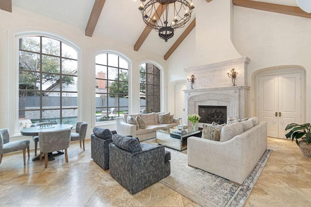 living room featuring an inviting chandelier, high vaulted ceiling, beamed ceiling, and a high end fireplace