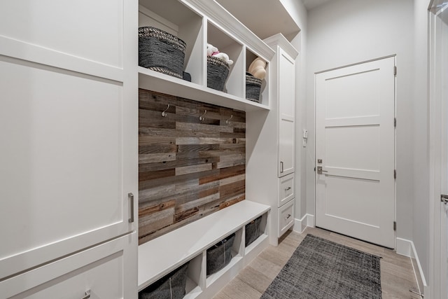 mudroom with light wood-style flooring