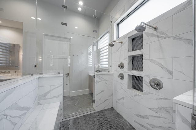 full bathroom with vanity, marble finish floor, and a walk in shower