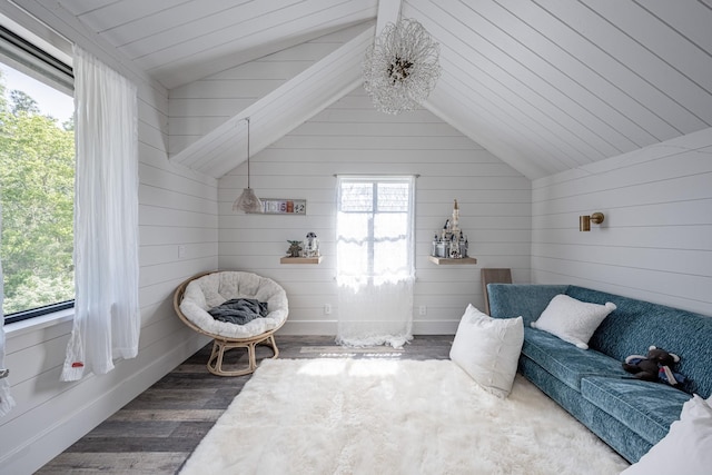 sitting room featuring wooden ceiling, wood walls, wood finished floors, and lofted ceiling