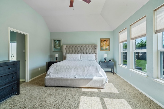 bedroom featuring carpet floors, ceiling fan, baseboards, and vaulted ceiling