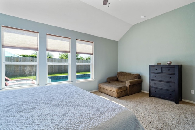 bedroom featuring a ceiling fan, baseboards, carpet, and vaulted ceiling
