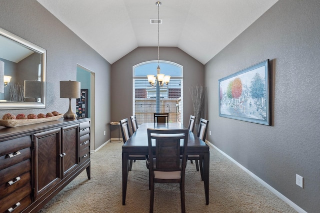 dining space with an inviting chandelier, visible vents, a textured wall, lofted ceiling, and light carpet