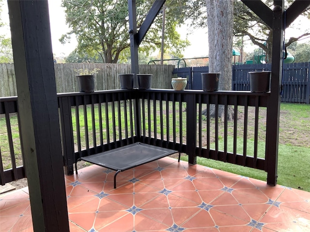 view of patio / terrace with a fenced backyard and a deck