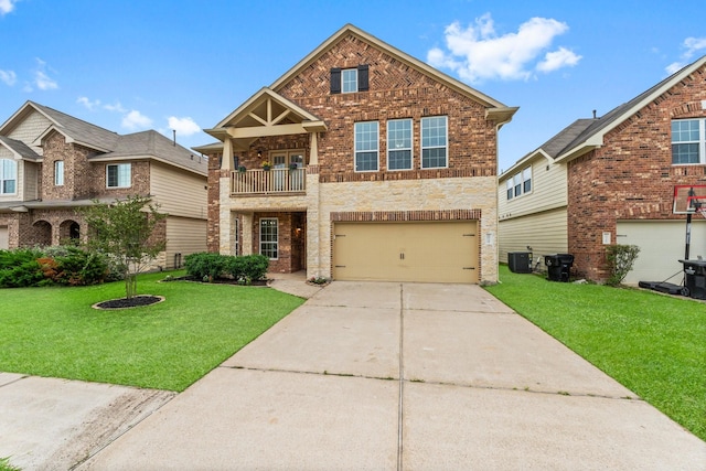 view of front of property with a garage, concrete driveway, a front yard, and a balcony
