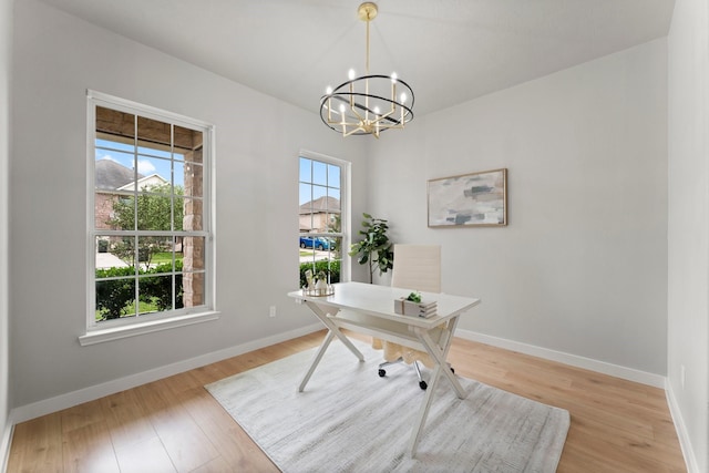 office with an inviting chandelier, baseboards, and light wood-type flooring