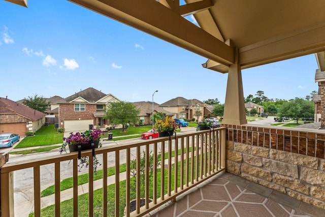 balcony featuring a porch and a residential view