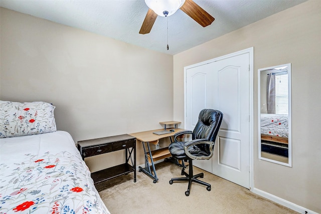 bedroom with baseboards, light carpet, and a ceiling fan
