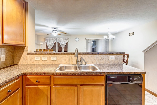 kitchen featuring decorative backsplash, black dishwasher, brown cabinets, a sink, and ceiling fan with notable chandelier