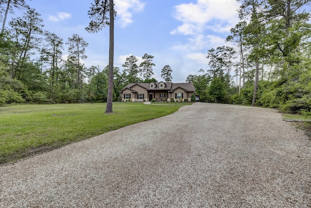 view of front of home with a front lawn and aphalt driveway