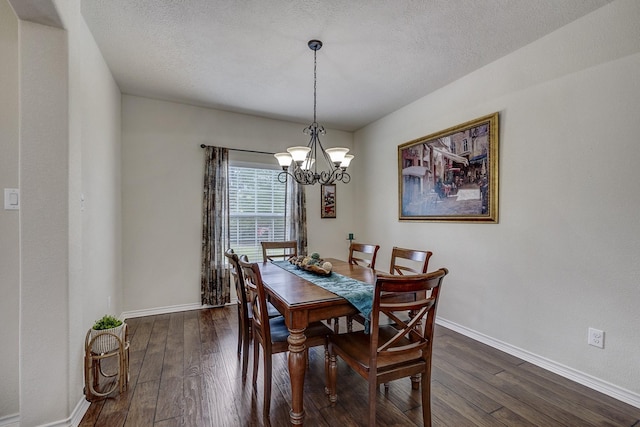 dining space with an inviting chandelier, baseboards, and dark wood-style flooring