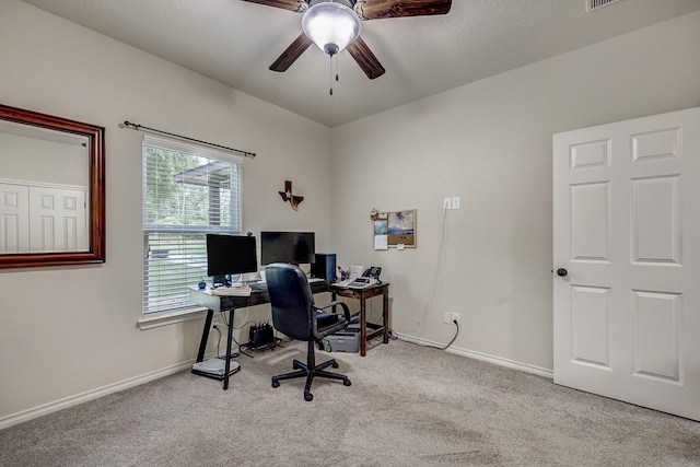 office area featuring baseboards, a ceiling fan, and carpet flooring