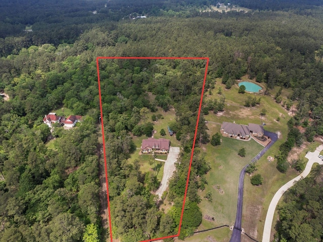 aerial view featuring a view of trees