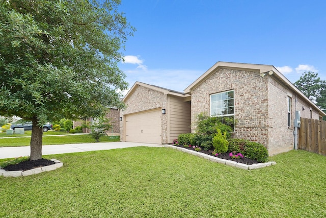 ranch-style home featuring an attached garage, fence, a front yard, and concrete driveway