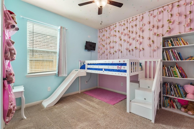unfurnished bedroom featuring baseboards, a ceiling fan, and carpet flooring