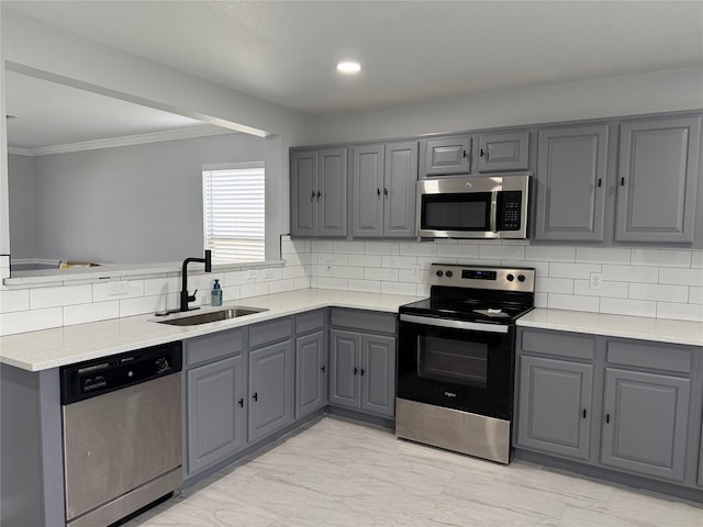 8127 Chancewood Ln, Humble, TX 77338 - kitchen featuring a sink, gray cabinets, backsplash, and stainless steel appliances