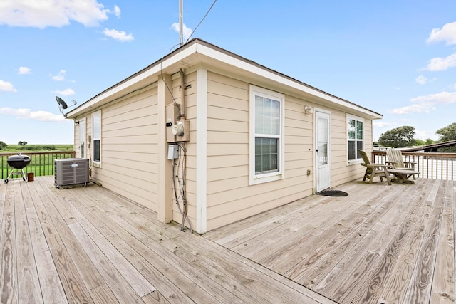 wooden terrace featuring central air condition unit