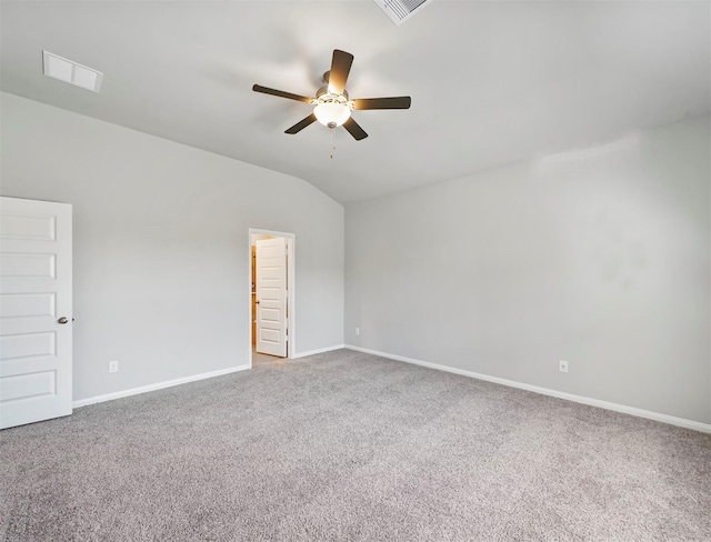 spare room with visible vents, lofted ceiling, baseboards, ceiling fan, and carpet flooring
