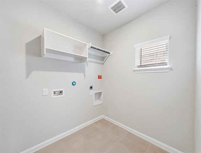 clothes washing area with laundry area, visible vents, hookup for a gas dryer, hookup for a washing machine, and hookup for an electric dryer