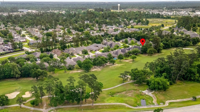 aerial view with golf course view and a residential view