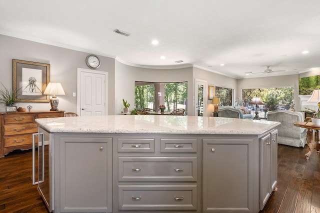 kitchen featuring visible vents, recessed lighting, gray cabinetry, and ornamental molding