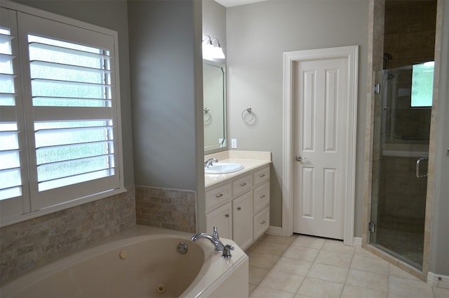 bathroom with a jetted tub, tile patterned flooring, a wealth of natural light, and a shower stall