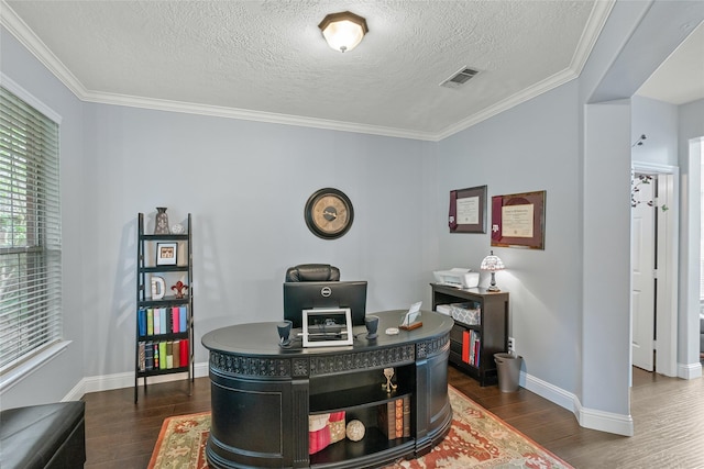 office featuring a textured ceiling, dark wood finished floors, baseboards, visible vents, and ornamental molding