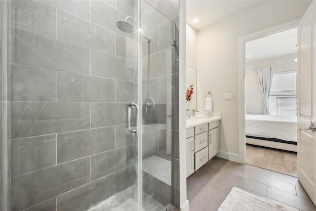 ensuite bathroom with vanity, a shower stall, and ensuite bath