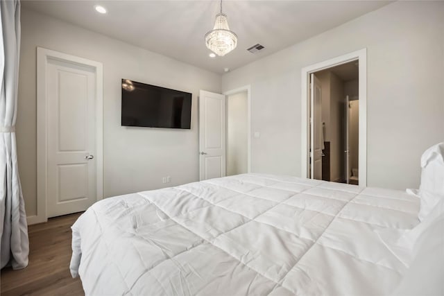 bedroom with recessed lighting, wood finished floors, and visible vents