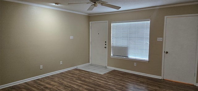 2350 Bering Dr Unit 114, Houston, TX 77057 - foyer featuring crown molding, baseboards, ceiling fan, and wood finished floors