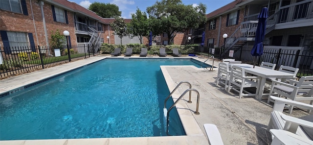 2350 Bering Dr Unit 114, Houston, TX 77057 - pool with fence and a patio