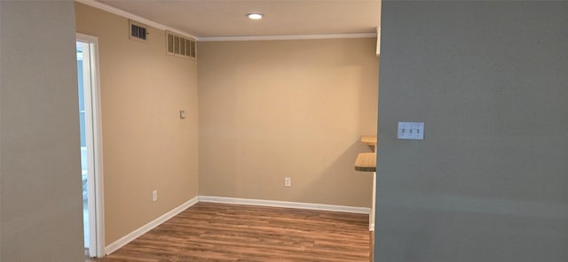 2350 Bering Dr Unit 114, Houston, TX 77057 - empty room featuring baseboards, visible vents, ornamental molding, and wood finished floors