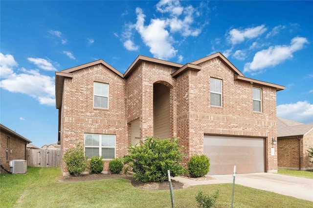 traditional-style home featuring a garage, a front yard, brick siding, central air condition unit, and driveway