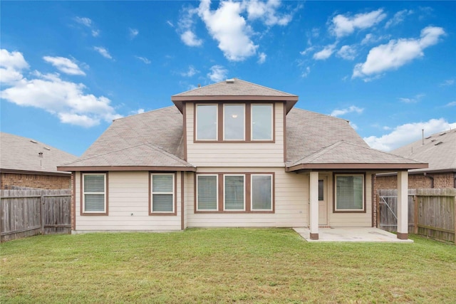 rear view of property featuring a fenced backyard, a patio area, a yard, and a shingled roof
