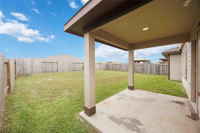 view of yard with a fenced backyard and a patio area