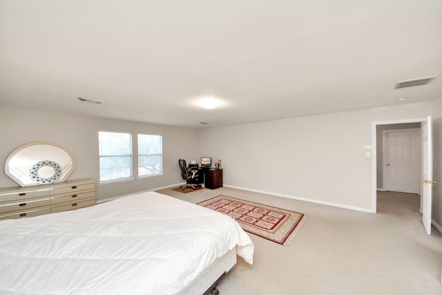 bedroom with baseboards, visible vents, and light carpet