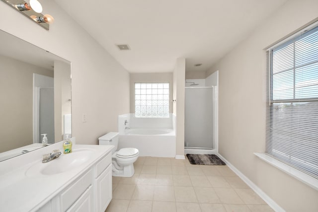 bathroom featuring visible vents, vanity, a bath, tile patterned floors, and a stall shower
