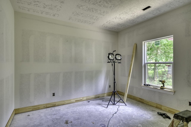 empty room with baseboards