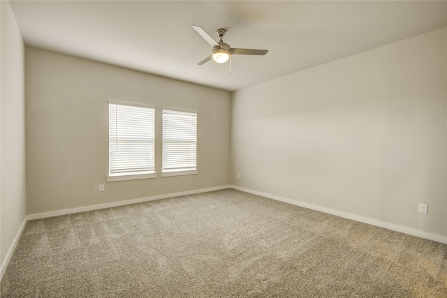 empty room with baseboards, carpet, and ceiling fan