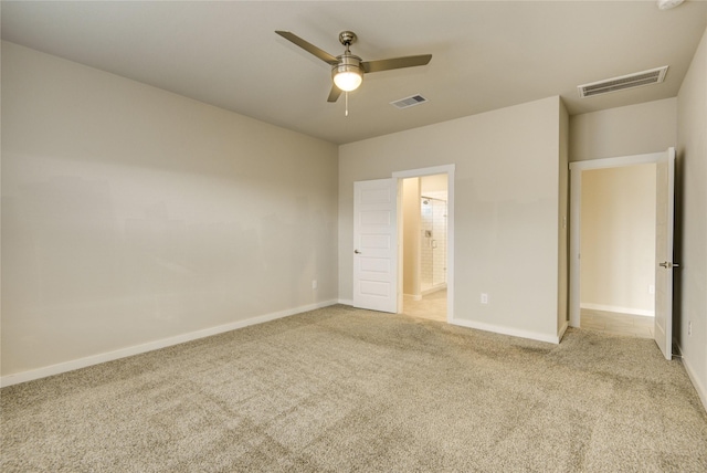 unfurnished bedroom featuring visible vents, baseboards, and light carpet