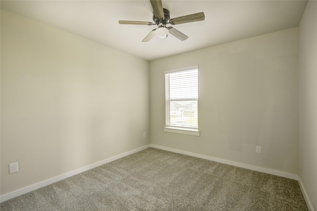 spare room with carpet flooring and baseboards
