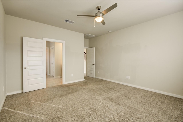 unfurnished bedroom featuring visible vents, carpet, and baseboards