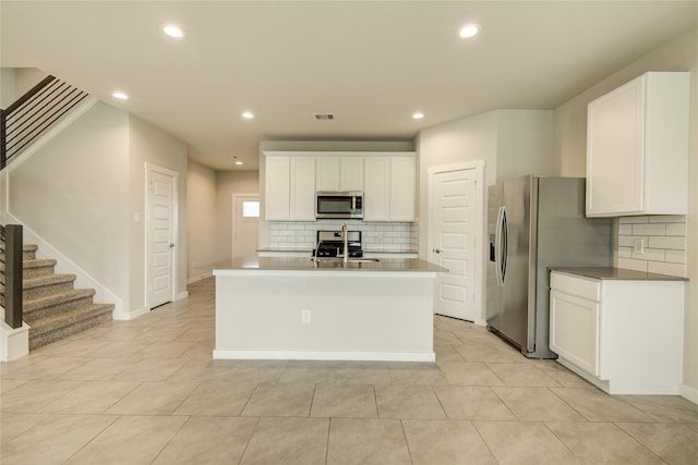 kitchen featuring appliances with stainless steel finishes, tasteful backsplash, recessed lighting, and visible vents