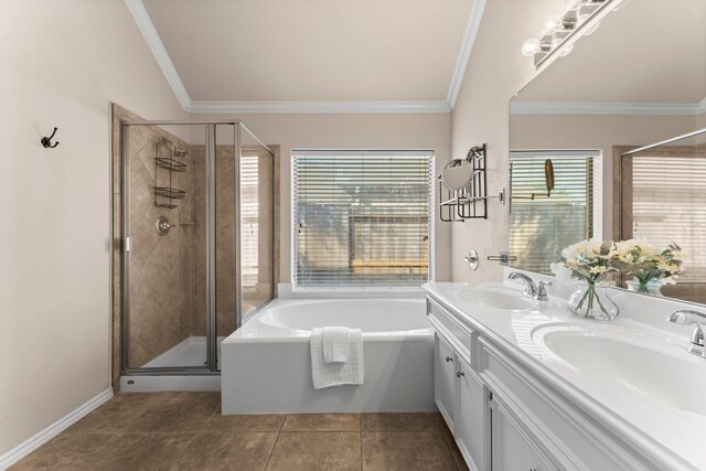 bathroom featuring a sink, a stall shower, and a healthy amount of sunlight