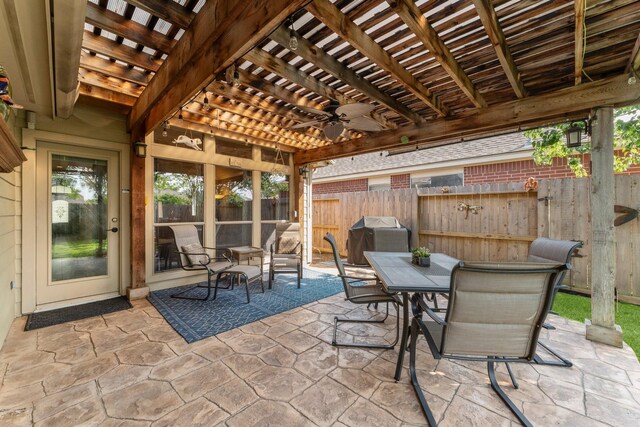 view of patio / terrace featuring ceiling fan, fence, a pergola, outdoor dining area, and area for grilling